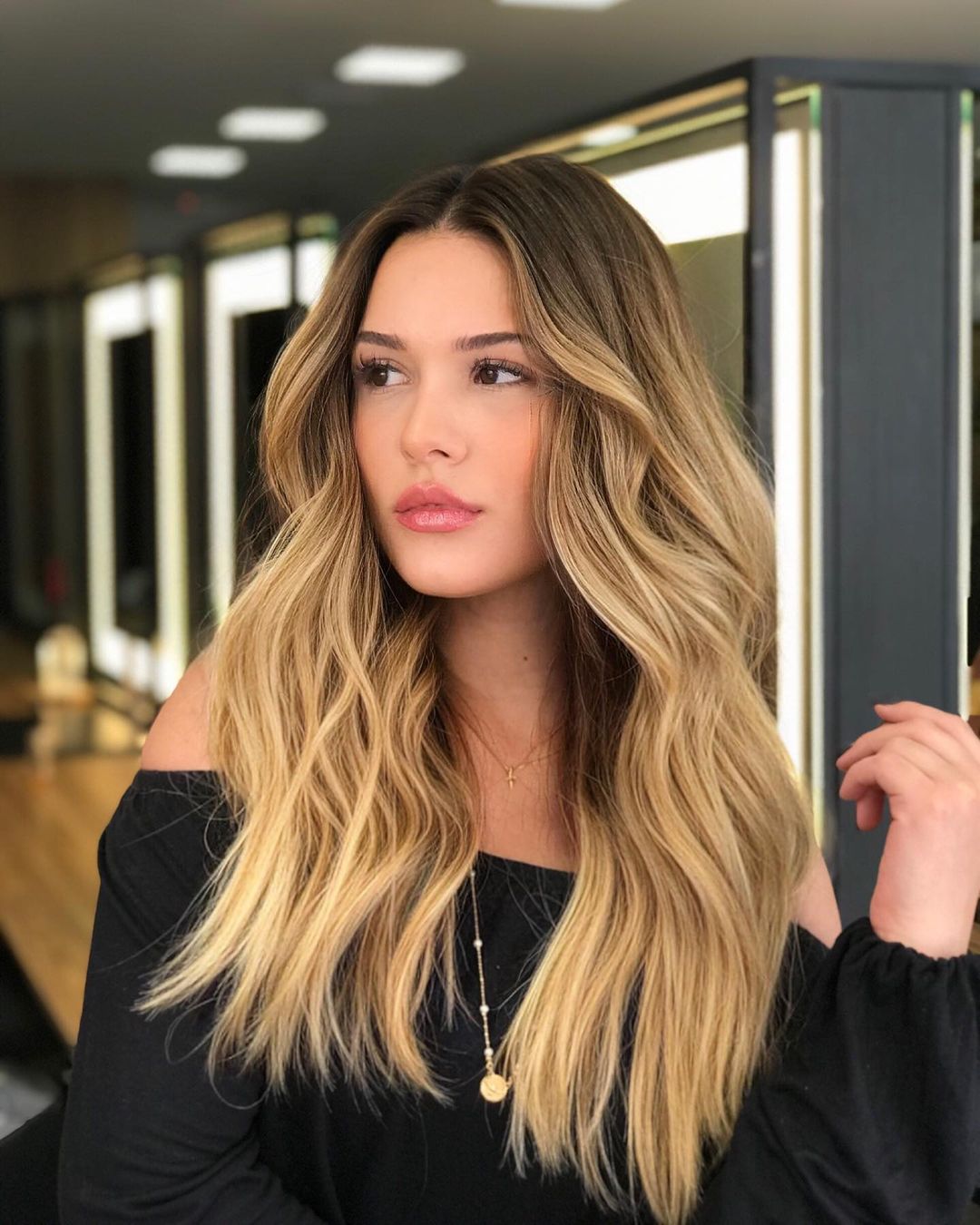 Mid-Back Golden Blonde Balayage With Curtain Bangs — Trendy Golden Blonde Hair