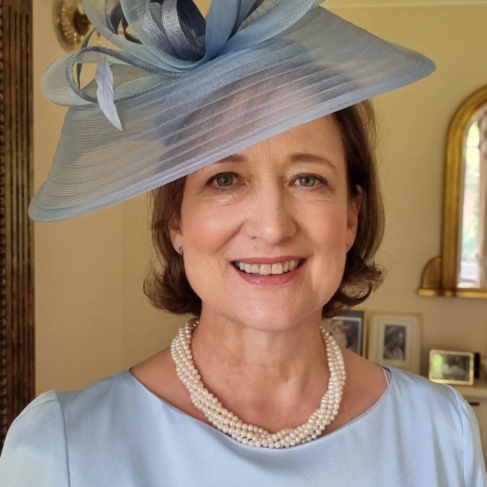 Chin Length Bob with Wispy Bangs and Blue Hat Chin Length Bob with Wispy Bangs and Blue Hat — Trendy Hair with Hat
