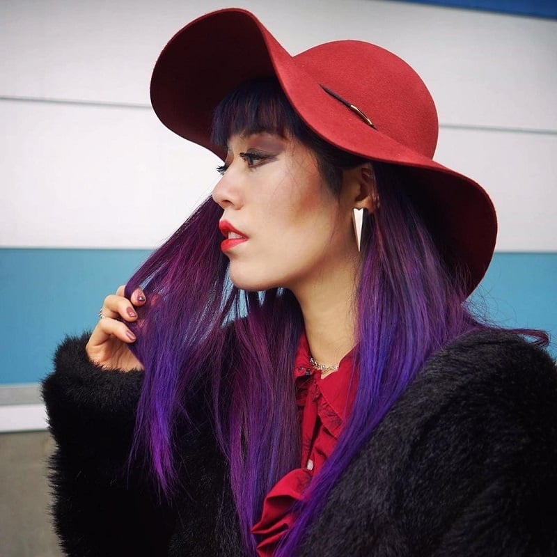 Mid-Back Vibrant Purple Hair with Curtain Bangs and Red Hat Mid-Back Vibrant Purple Hair with Curtain Bangs and Red Hat — Trendy Hair with Hat