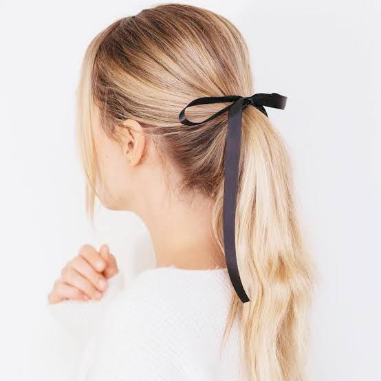 Blonde Ponytail With Black Ribbon Accent Blonde Ponytail With Black Ribbon Accent — Trendy Low Ponytail Hairstyles