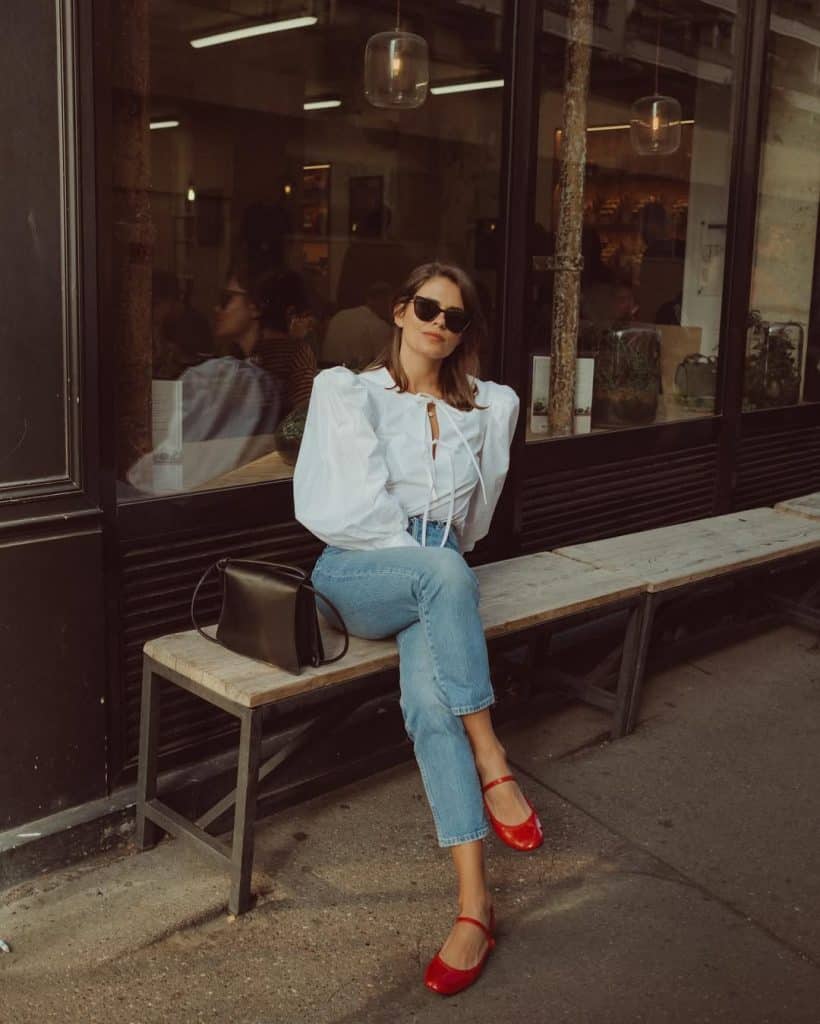 Red Mary Jane Flats with Puff-Sleeve Blouse and Cropped Jeans Red Mary Jane Flats with Puff-Sleeve Blouse and Cropped Jeans — Trendy Mary Janes Outfit