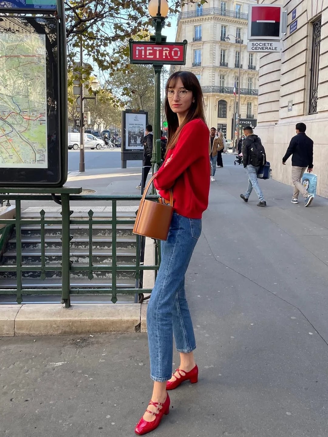 Red Mary Janes with Blue Jeans and Crewneck Sweater, Brown Bucket Bag Red Mary Janes with Blue Jeans and Crewneck Sweater, Brown Bucket Bag — Trendy Mary Janes Outfit
