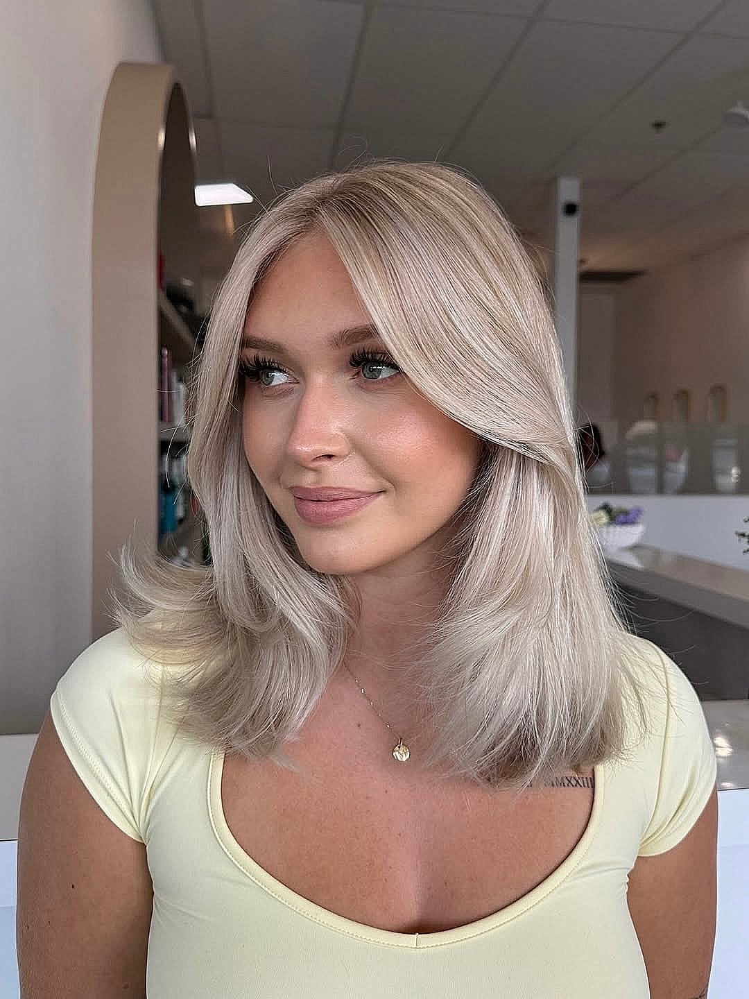 Collarbone Bob With Soft Layers And Curtain Bangs, Ash Blonde Collarbone Bob With Soft Layers And Curtain Bangs, Ash Blonde — Trendy Medium Hair