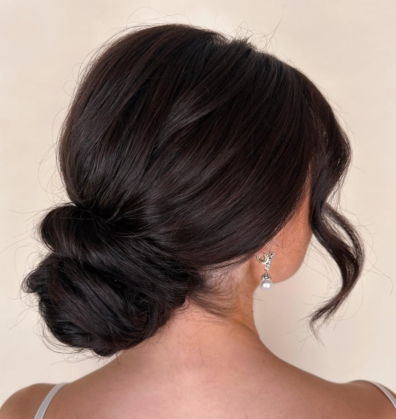 Elegant Low Dark Brown Bun Elegant Low Dark Brown Bun — Trendy Natural Bun