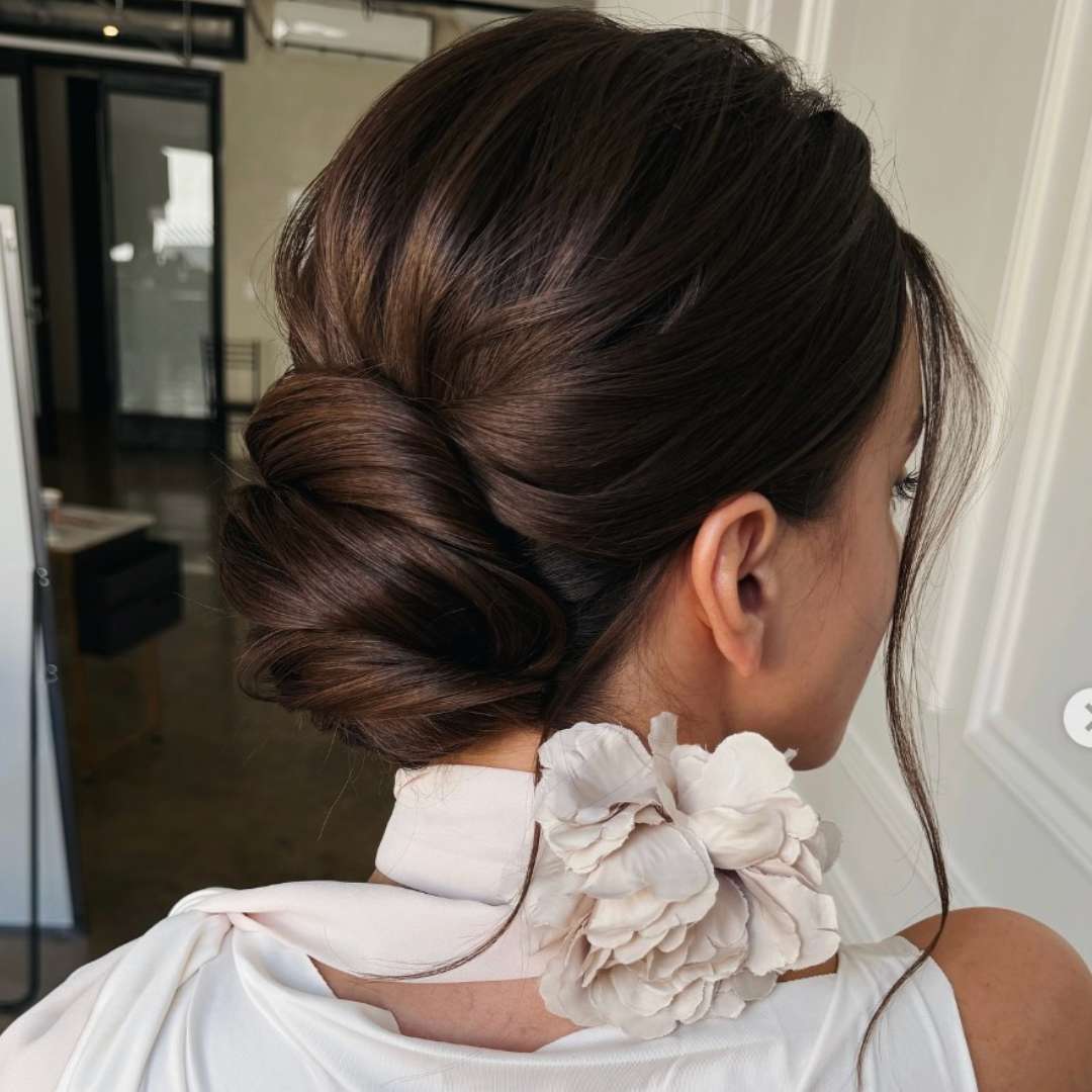 Sleek Dark Brown Bun Side Swept Bangs Sleek Dark Brown Bun Side Swept Bangs — Trendy Natural Bun