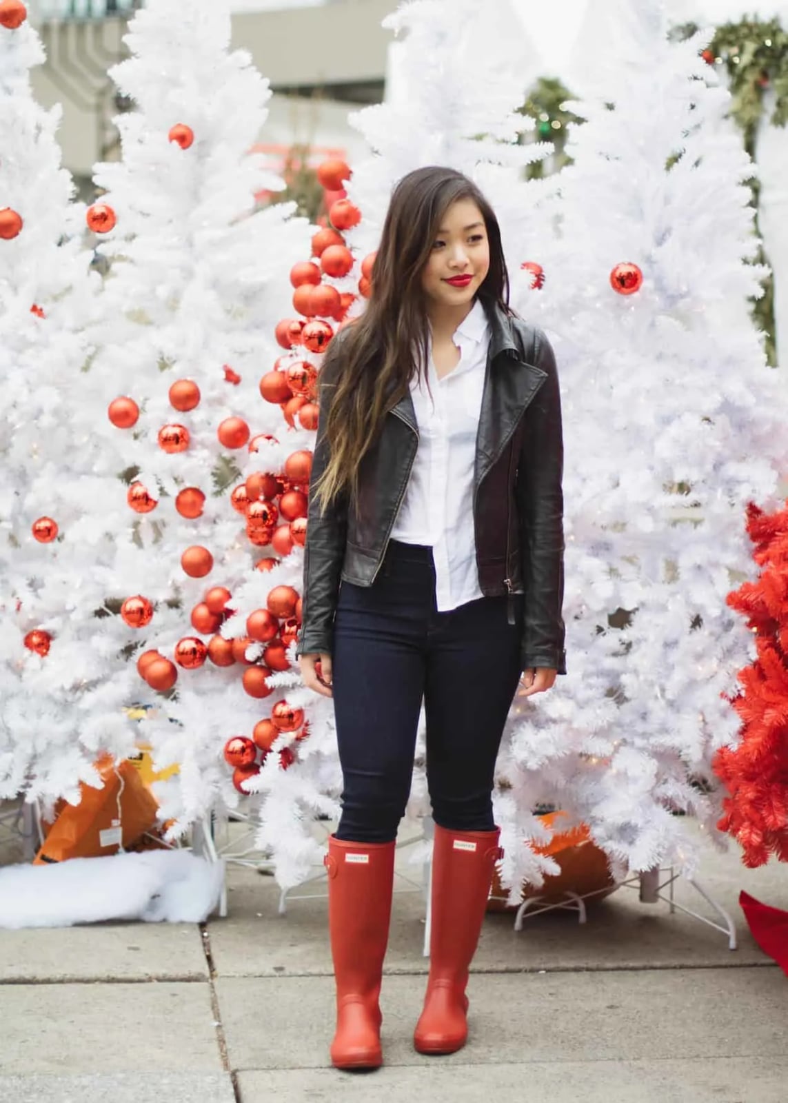 Red Hunter Boots With Fitted Jeans And Leather Jacket — Trendy Red Boots Outfit
