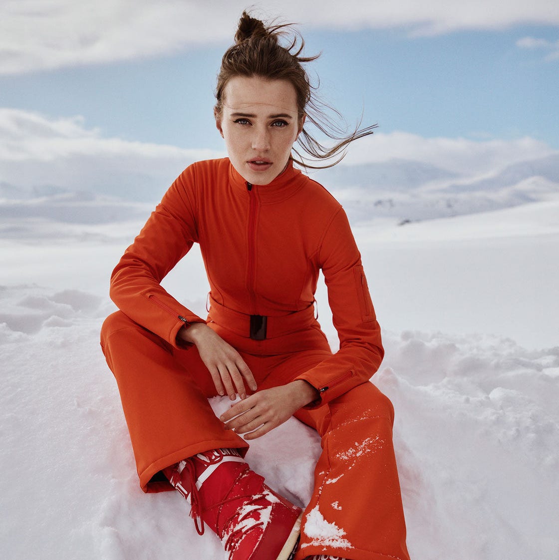 Red Snow Boots With Orange Ski Suit — Trendy Red Boots Outfit