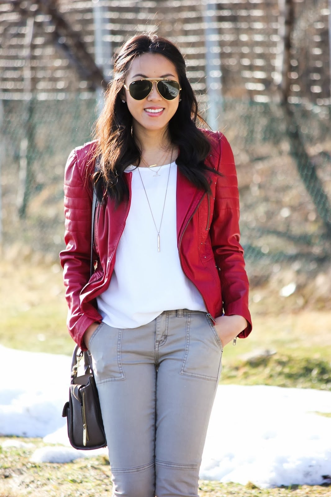 Bright Red Leather Biker Jacket With White Top And Gray Trousers Bright Red Leather Biker Jacket With White Top And Gray Trousers — Trendy Red Leather Jacket Outfit