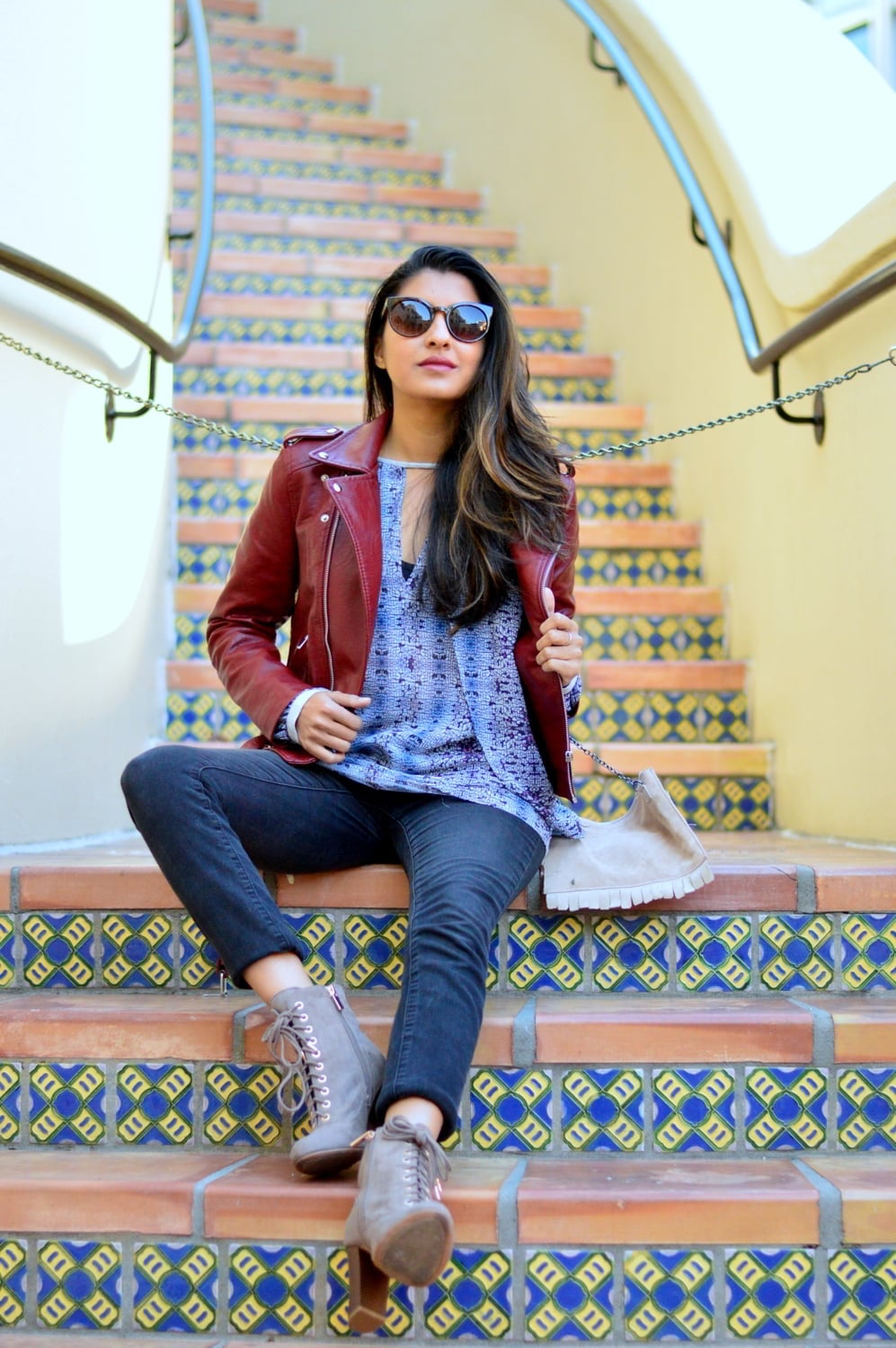 Burgundy Leather Jacket With Patterned Top And Slim Jeans Burgundy Leather Jacket With Patterned Top And Slim Jeans — Trendy Red Leather Jacket Outfit