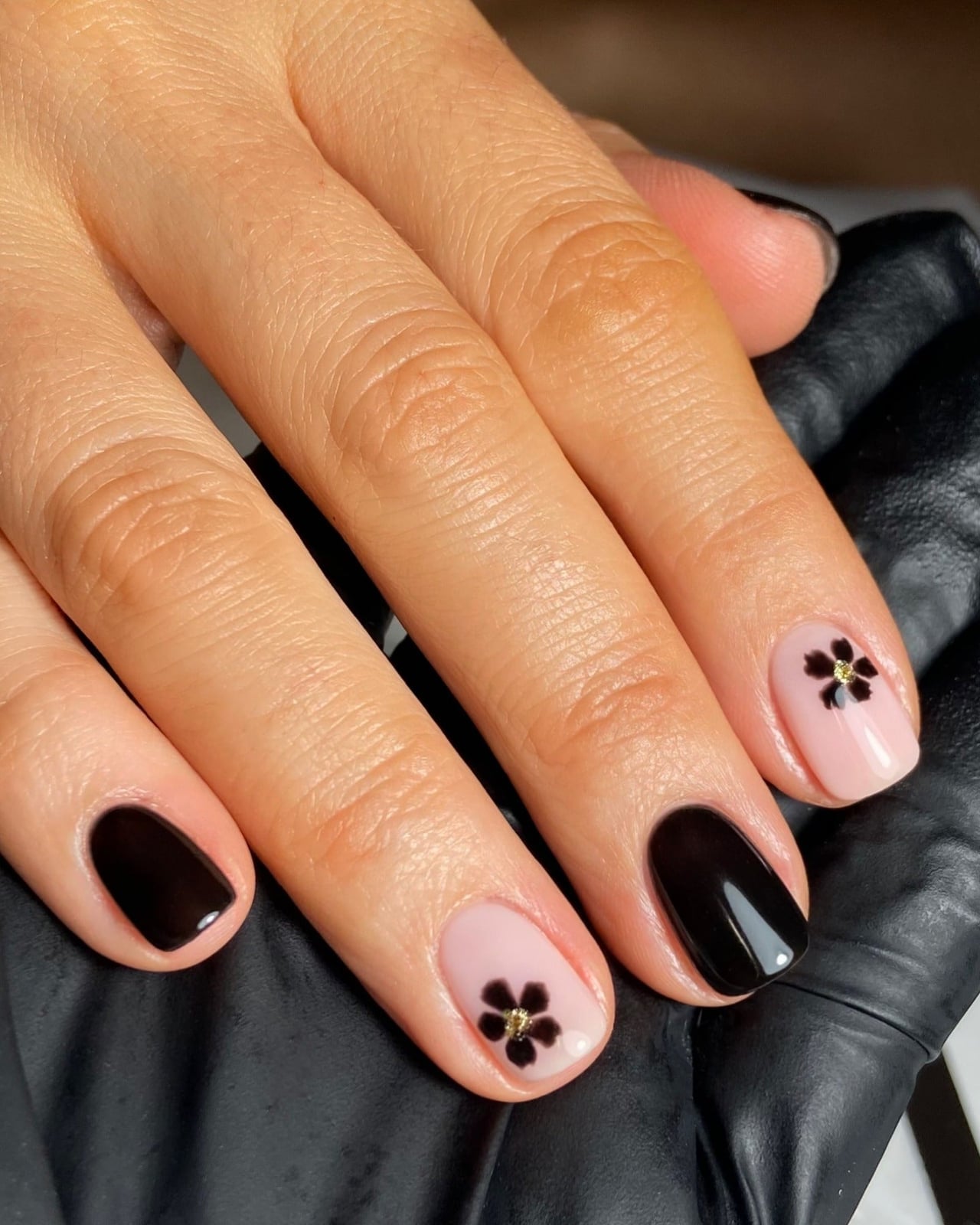 Black And Pink Short Oval Nails With Flower Motif — Trendy Short Black Nails