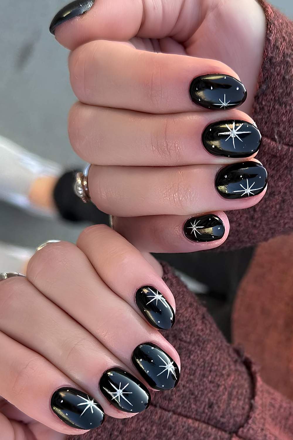 Glossy Black Short Oval Nails With White Starbursts — Trendy Short Black Nails