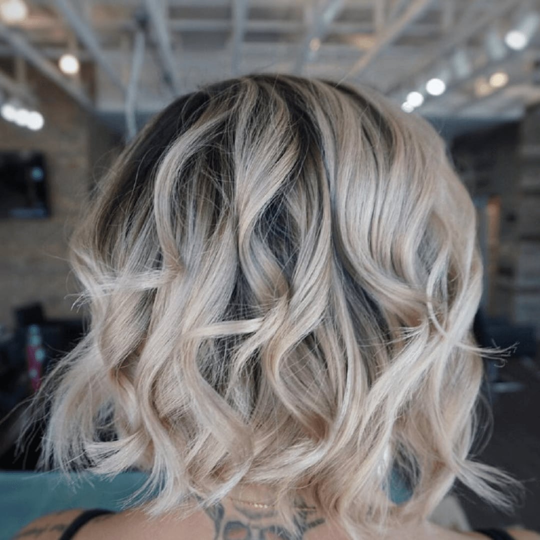 Angled Ash Blonde Bob With Soft Waves — Trendy Short Hair