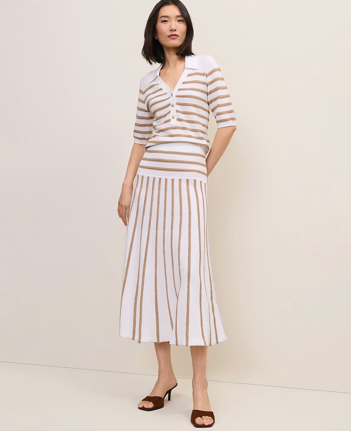 White And Gold Striped Knit Midi Skirt With Polo Top, Close-Up Take — Trendy Striped Skirt Outfit