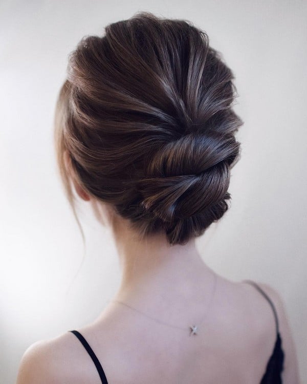 Smooth Dark Brown Rolled Updo — Trendy Wedding Bun