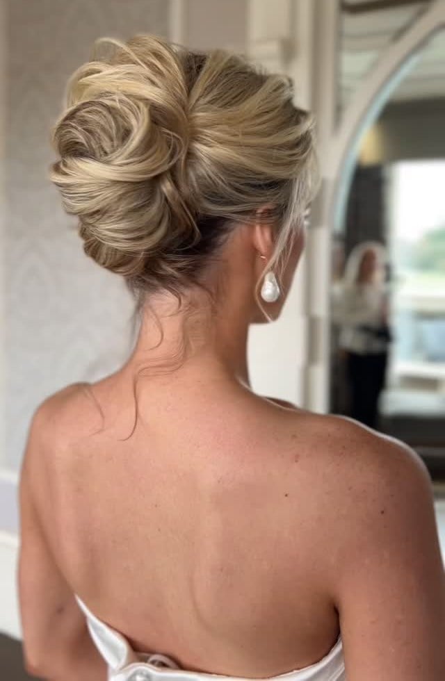 Elegant Ash Blonde Twisted Low Bun — Trendy Wedding Bun