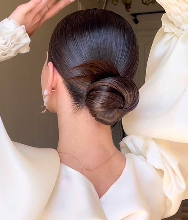 Sleek Dark Brown Low Bun Glossy Finish — Trendy Wedding Bun