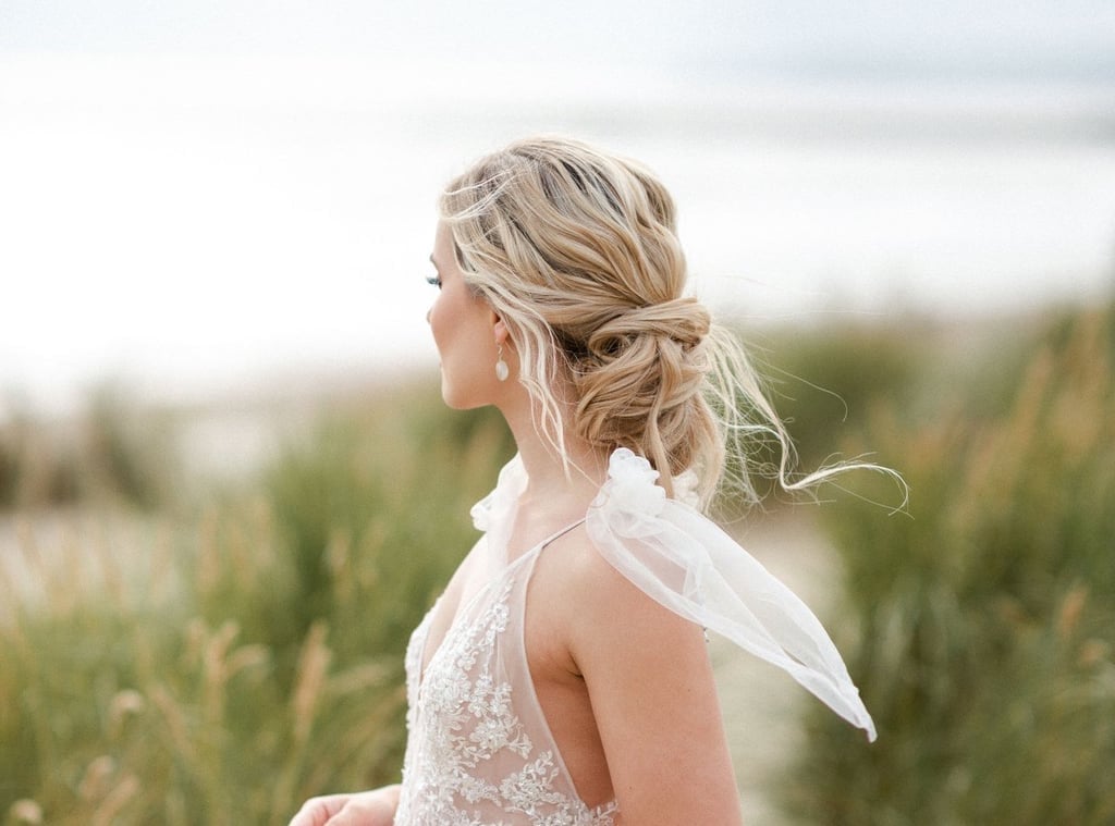 Blonde Messy Bun With Loose Tendrils — Trendy Wedding Bun