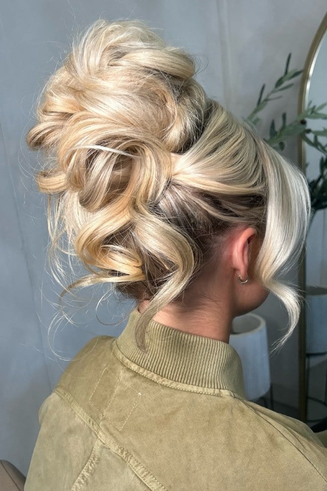 Voluminous Blonde Messy High Bun, Face-Framing Pieces — Trendy Wedding Bun