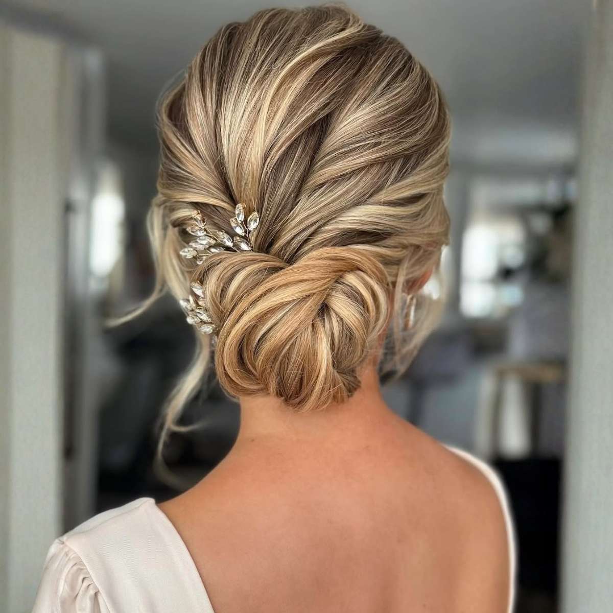 Textured Blonde Updo With Crystal Accessory — Trendy Wedding Bun
