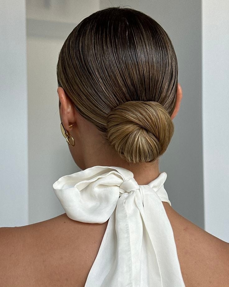 Sleek Dark Blonde Low Bun — Trendy Wedding Bun